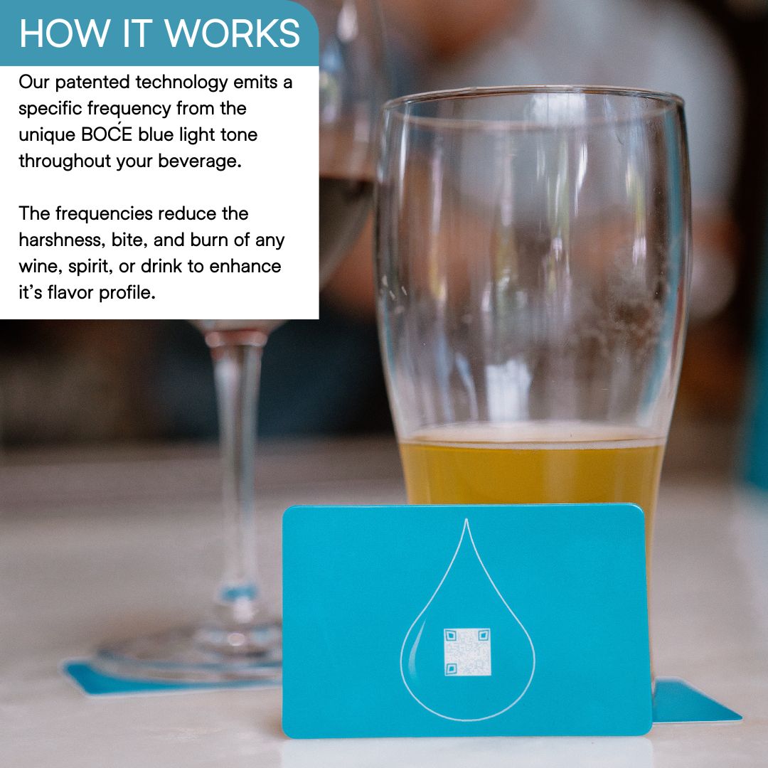 Blue BOĆE card standing upright on a table in front of a glass of beer, highlighting patented drink enhancement technology.