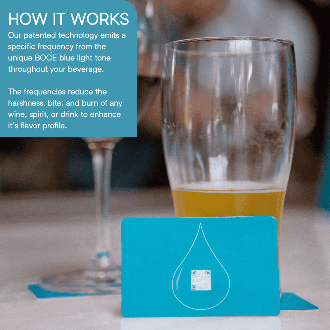 Blue BOĆE card standing upright on a table in front of a glass of beer, highlighting patented drink enhancement technology.