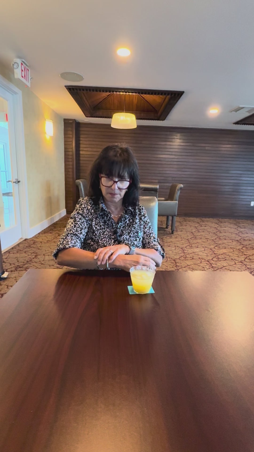 Woman taking the BOCE challenge using the card coasters with vodka